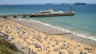 Bournemouth beach busy again as coastguard urges people to ‘take extra care’ in sea [upl. by Lebatsirc]