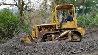 Caterpillar D4 7U dozer pushing gravel [upl. by Ainattirb]