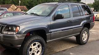 Installing the Rough Country 4 inch lift on the Jeep Grand Cherokee WJ lift kit [upl. by Irb283]