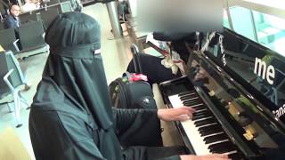 Burka Pianist Amazes Passengers at The Airport [upl. by Ahseikal]